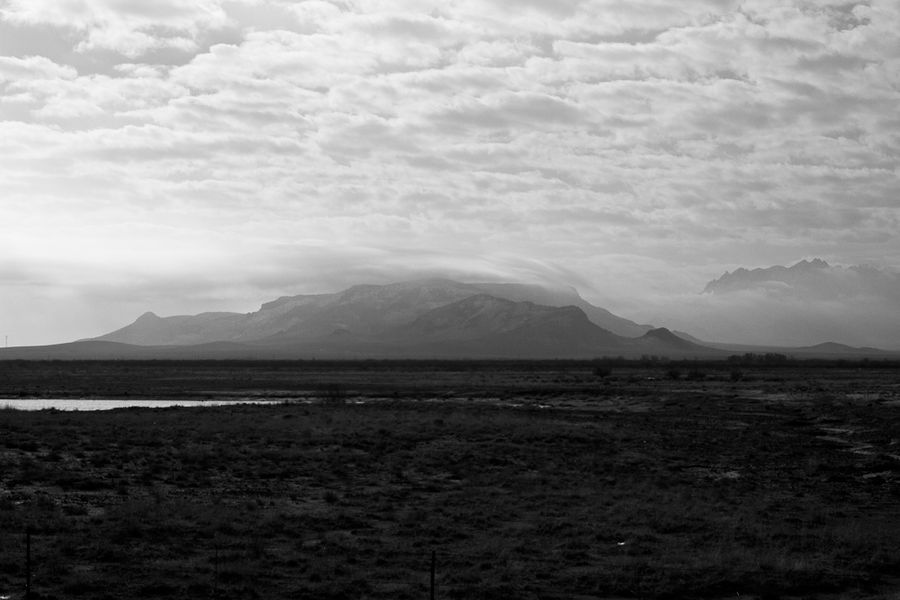 Clouds scrape mountaintop