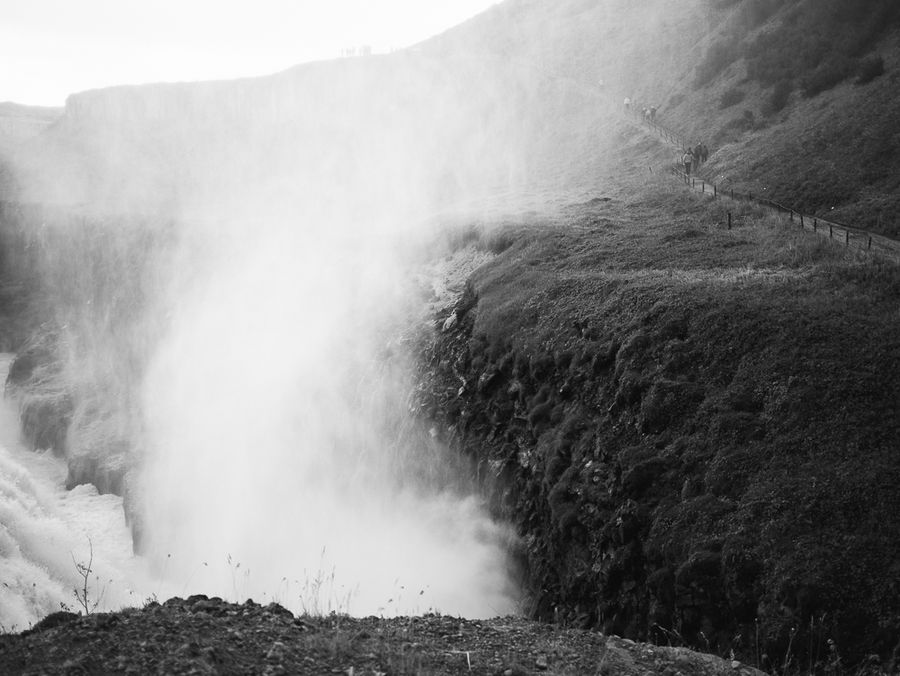 Path through waterfall mist