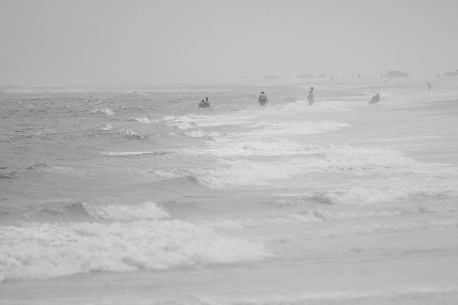 People in heavy surf